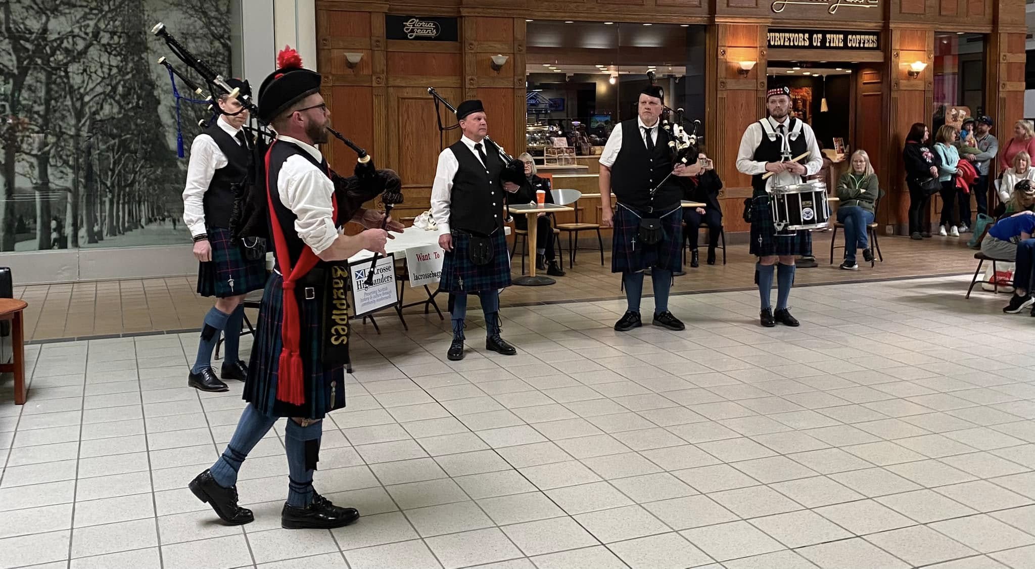Band members in Campbell of Cawdor tartan